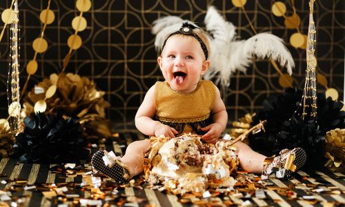 happy-baby-eating-cake-her-first-birthday-party-cakesmash-little-girl